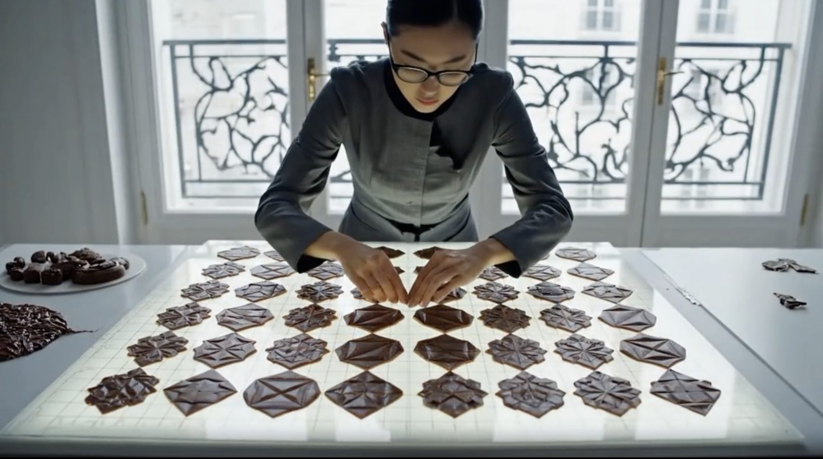 Sculpted chocolate tiles laid down like textiles.